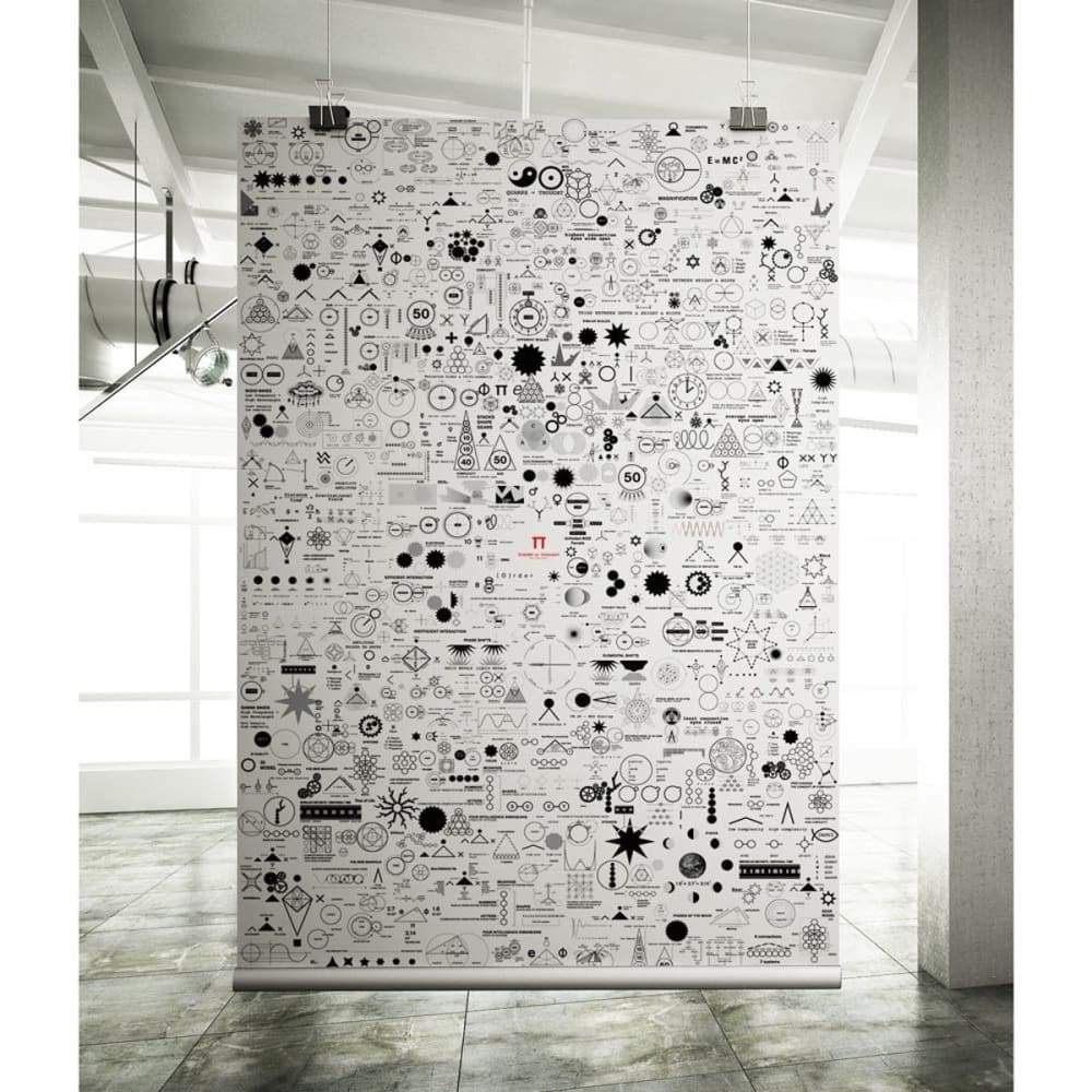 A Printed Poster featuring black-and-white geometric symbols and shapes decorates an industrial-style room with concrete floors, large windows, and exposed pipes.