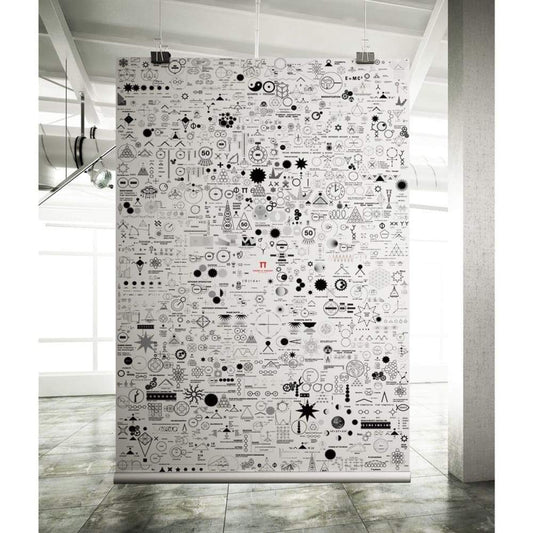 A Printed Poster featuring black-and-white geometric symbols and shapes decorates an industrial-style room with concrete floors, large windows, and exposed pipes.